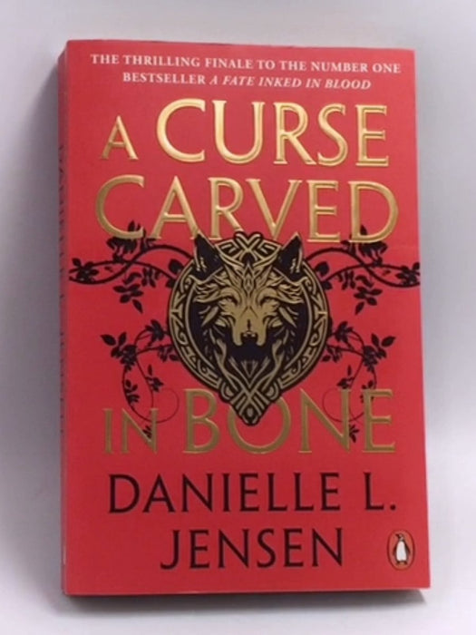 A curse carved in bone  -  Danielle L. Jensen