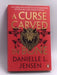 A curse carved in bone  -  Danielle L. Jensen
